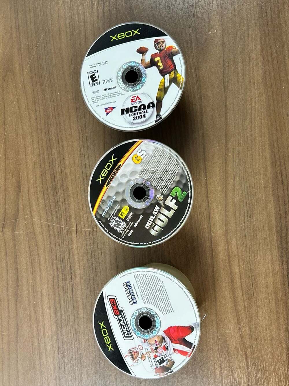 Original Xbox Lot 3 NCAA Football 2004 NCAA 2K3 Outlaw Golf 2 Disc Only Untested